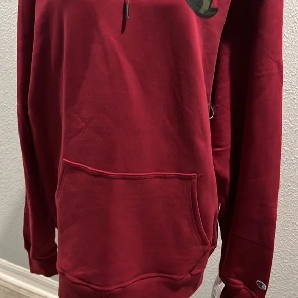 Mens Cozy up with this champion hoodie, cranberry in color with camo writing - Picture 6 of 12